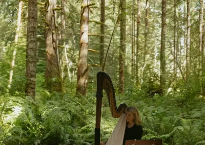 Leigh Brown Portland Harpist playing among ferns